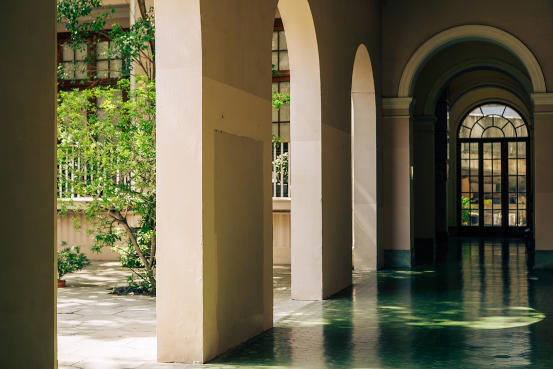 Digital signage display in a university corridor showing campus events and navigation
