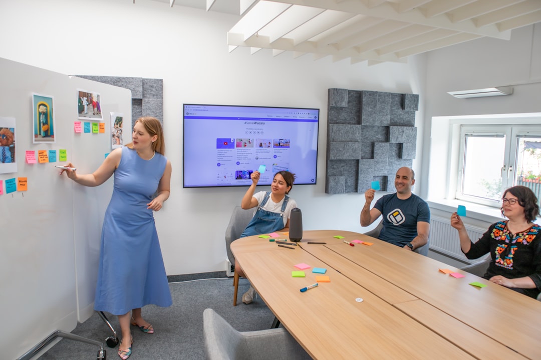 Teams Rooms vs Zoom Rooms, conference room with video call on large display screen
